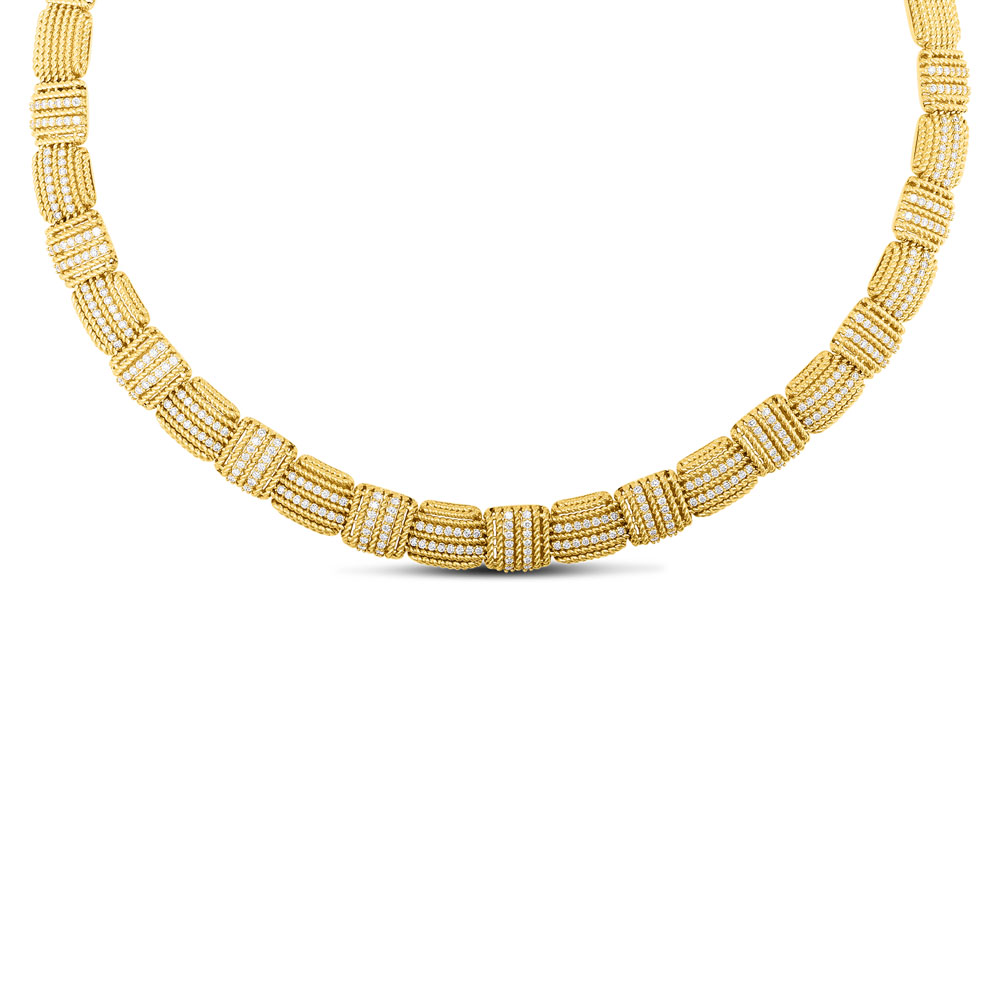 This 18K yellow gold flexible diamond necklace is part of the Opera Collection designed by Roberto Coin. The necklace features 39 stations total of cable design: 20 stations running east to west; 19 stations running north to south. The 21 stations at the front of the necklace each have two rows of pave set diamonds. The total diamond weight is 2.70 carat. The necklace measures 18 inches in length and 10mm wide and has a push button clasp.